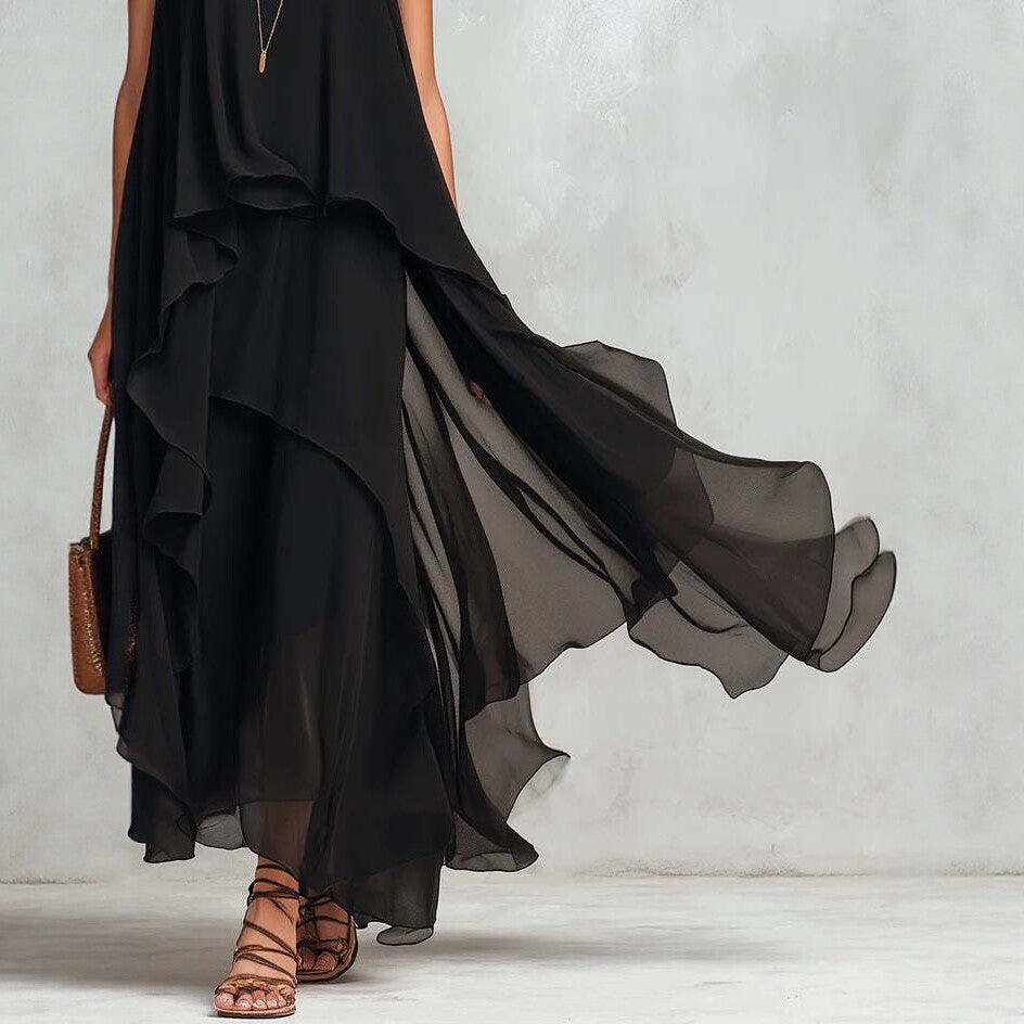 Schickes, fließendes, ärmelloses langes Chiffonkleid in Schwarz mit asymmetrischem Schnitt
